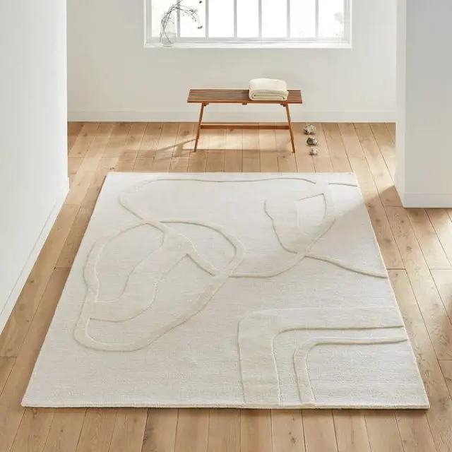 meuble slow deco salon tapis blanc relief en ton sur ton