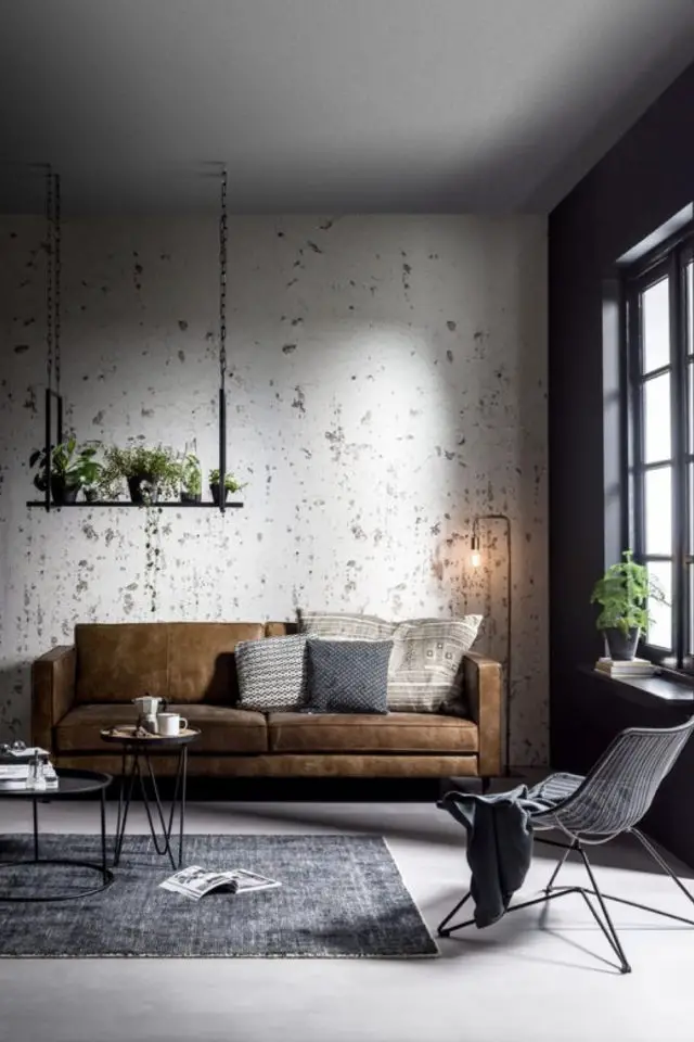 decor masculin materiaux couleurs exemple salon canapé en cuir cognac mur brut blanc gris