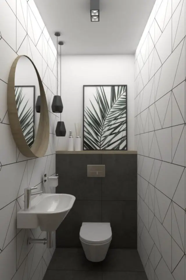 decoration toilettes salle de bain exemple ambiance moderne papier pient blanc lave main miroir rond tableau tropical