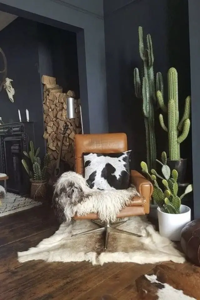 salon masculin fauteuil cuir naturel salon séjour cactus rangement bûche tapis et plaid fourrure