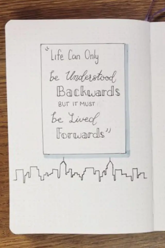 journal de voyage exemple citation encadrée simple avec skyline dessinée au crayon