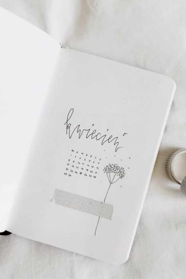 bullet journal minimaliste exemple calendrier illustration en noir et blanc petite fleur masking tape