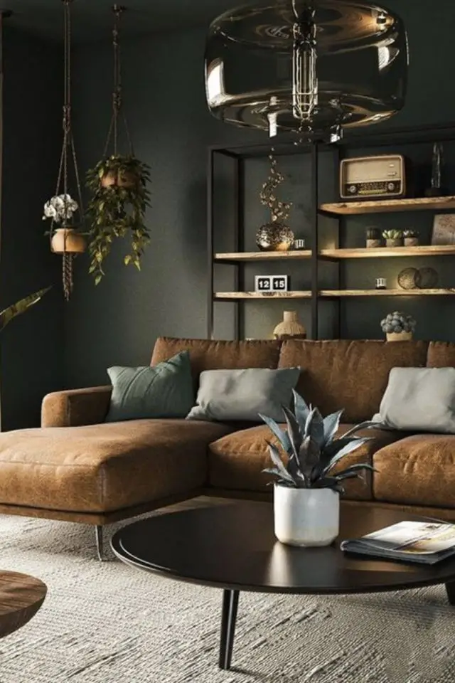 deco interieure couleur kaki exemple canapé d'angle en cuir étagère bois et métal noir salon moderne chic