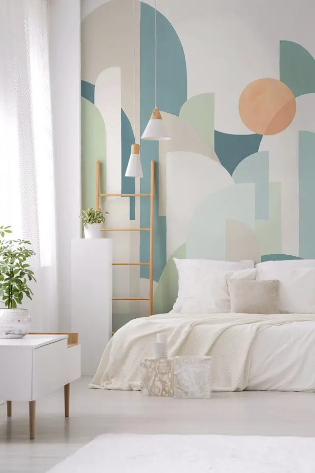 chambre adulte deco mur dessus lit papier peint panoramique XXL moderne multicolore pastel forme géométrique