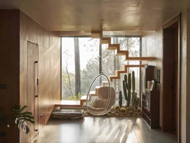 voyage vietnam dormir villa design moderne 1coin repos lumière naturelle et bois grande baie vitrée fauteuil suspendu
