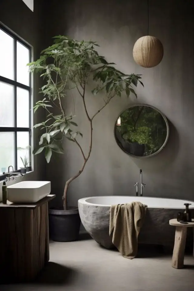 decor wabi sabi caracteristiques salle de bain baignoire îlot en pierre béton ciré au mur arbuste douceur calme tranquillité apaisement