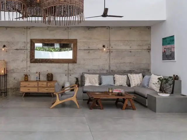 villa a louer vacances uniques sri lanka décor grand salon ouvert canapé d'angle 10 personnes mur en plaque de béton moderne