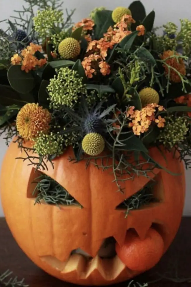 décoration halloween chic citrouille et fleurs visage effrayant découpage bricolage automne oeillet d'Inde 
