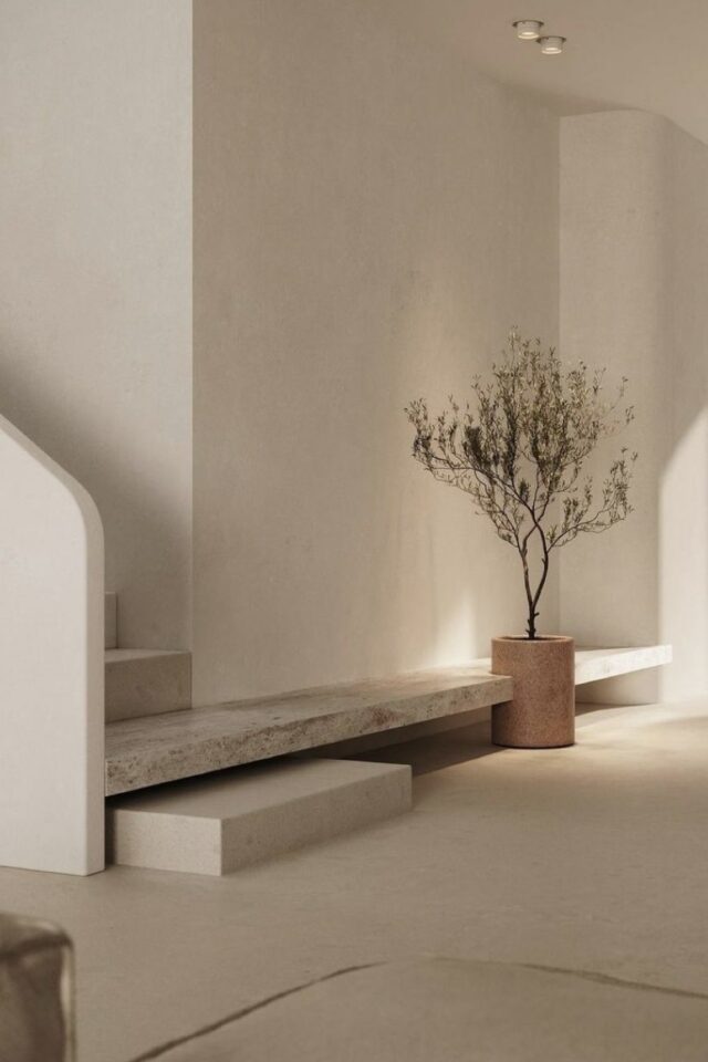 photo hall d'entrée moderne minimaliste épuré mur blanc sol beige marche d'escaliers qui continue en banc marbre intégration pot de fleur XXL photo hall d'entrée moderne minimaliste épuré mur blanc sol beige marche d'escaliers qui continue en banc marbre intégration pot de fleur XXL